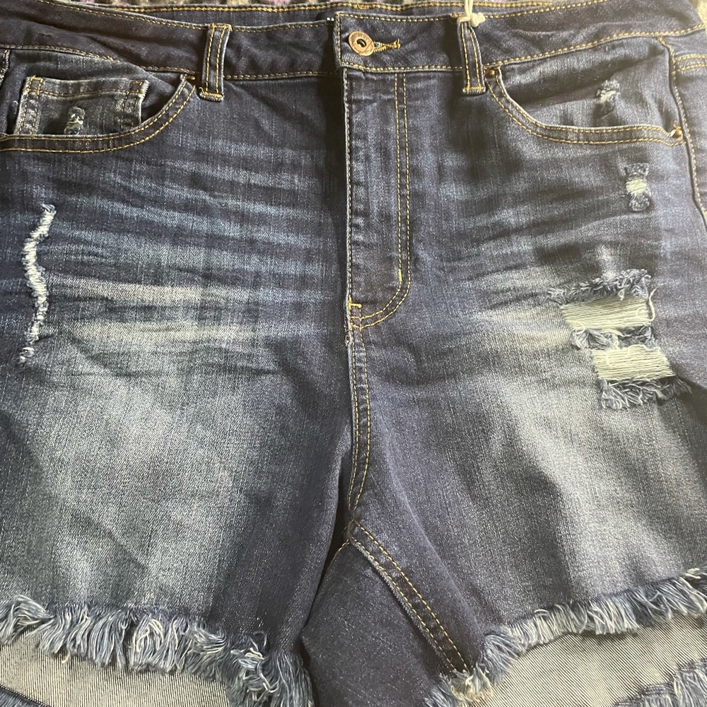 Dark blue jeans with rips